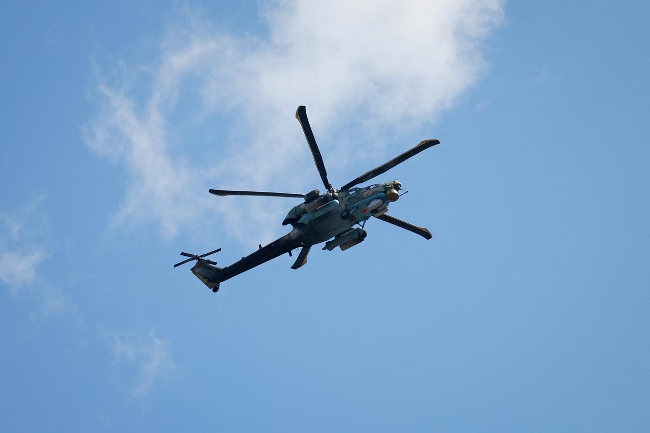 A Russian Mi-28 military helicopter flies above Donetsk