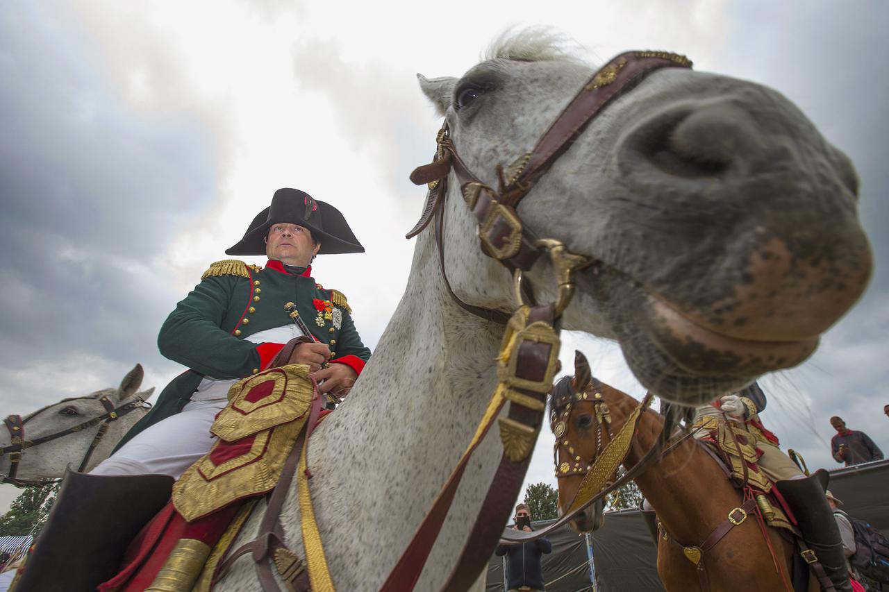 Re-enactor Frenchman Frank Samson, who plays Napoleon, visits the French troops' bivouac camp during the bicentennial celebrations for the Battle of Waterloo, in Waterloo, Belgium June 19, 2015. The commemorations for the 200th anniversary of the Battle o