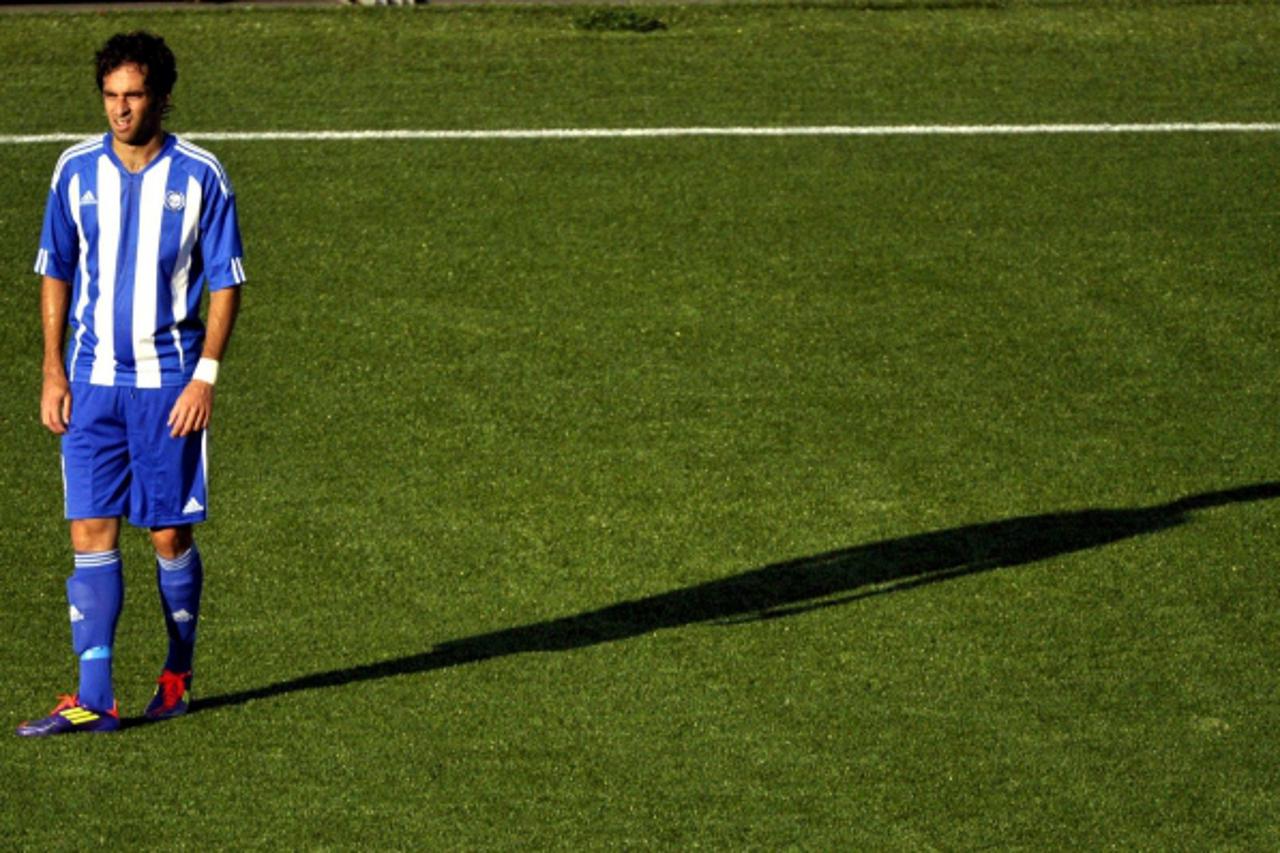 \'Rafinha of HJK reacts after scoring an own goal during UEFA Champions League soccer match against Dinamo Zagreb in Helsinki, Finland, July 27, 2011.  REUTERS/Kimmo Mantyla/Lehtikuva (FINLAND - Tags: