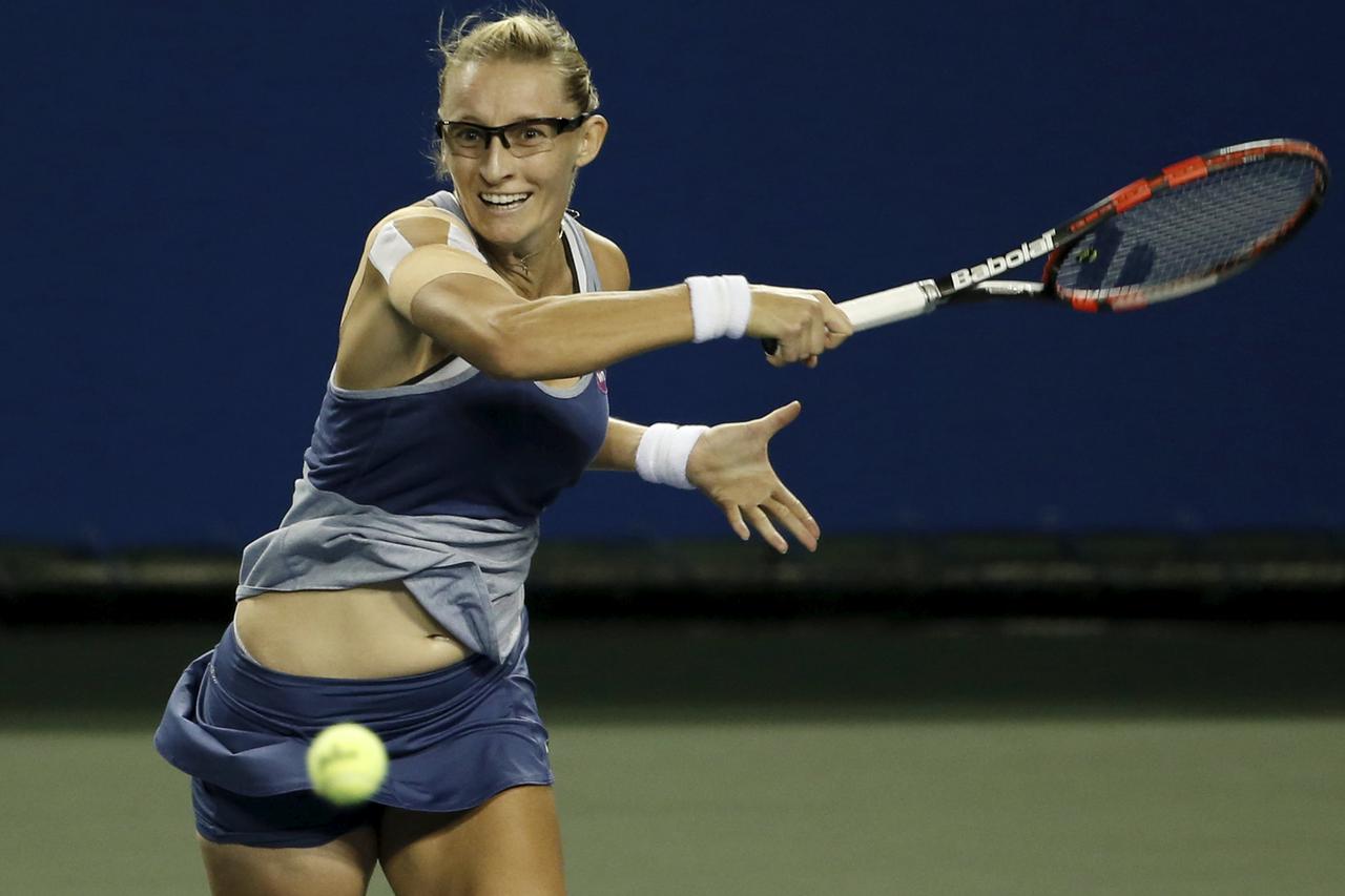 Mirjana Lucic-Baroni of Croatia returns a shot to Dominika Cibulkova of Slovakia during their Pan Pacific Open women's singles tennis match in Tokyo, Japan, September 22, 2015. REUTERS/Yuya Shino  Picture Supplied by Action Images