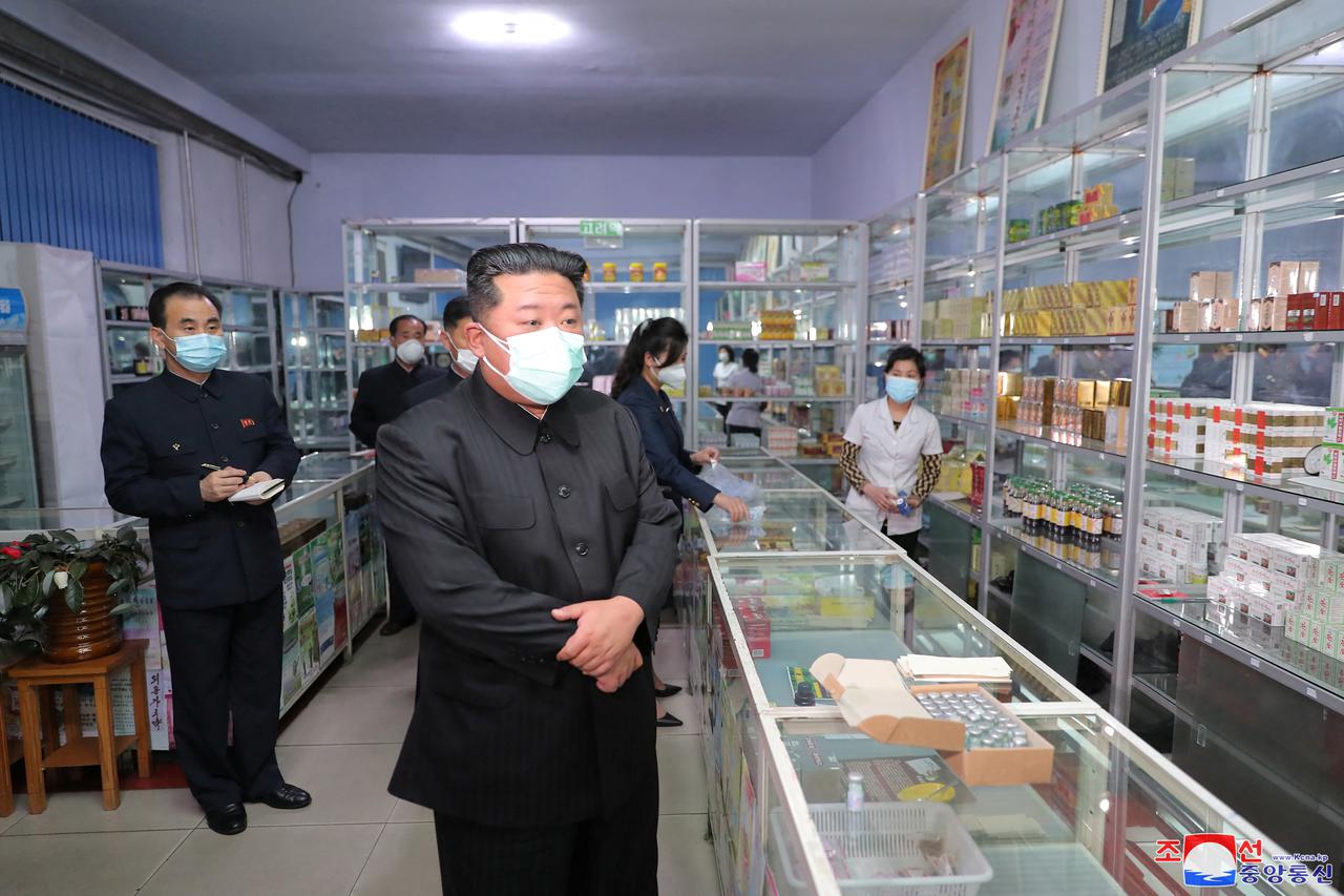 North Korean leader Kim Jong Un wears a face mask amid the coronavirus disease (COVID-19) outbreak, while inspecting a pharmacy in Pyongyang