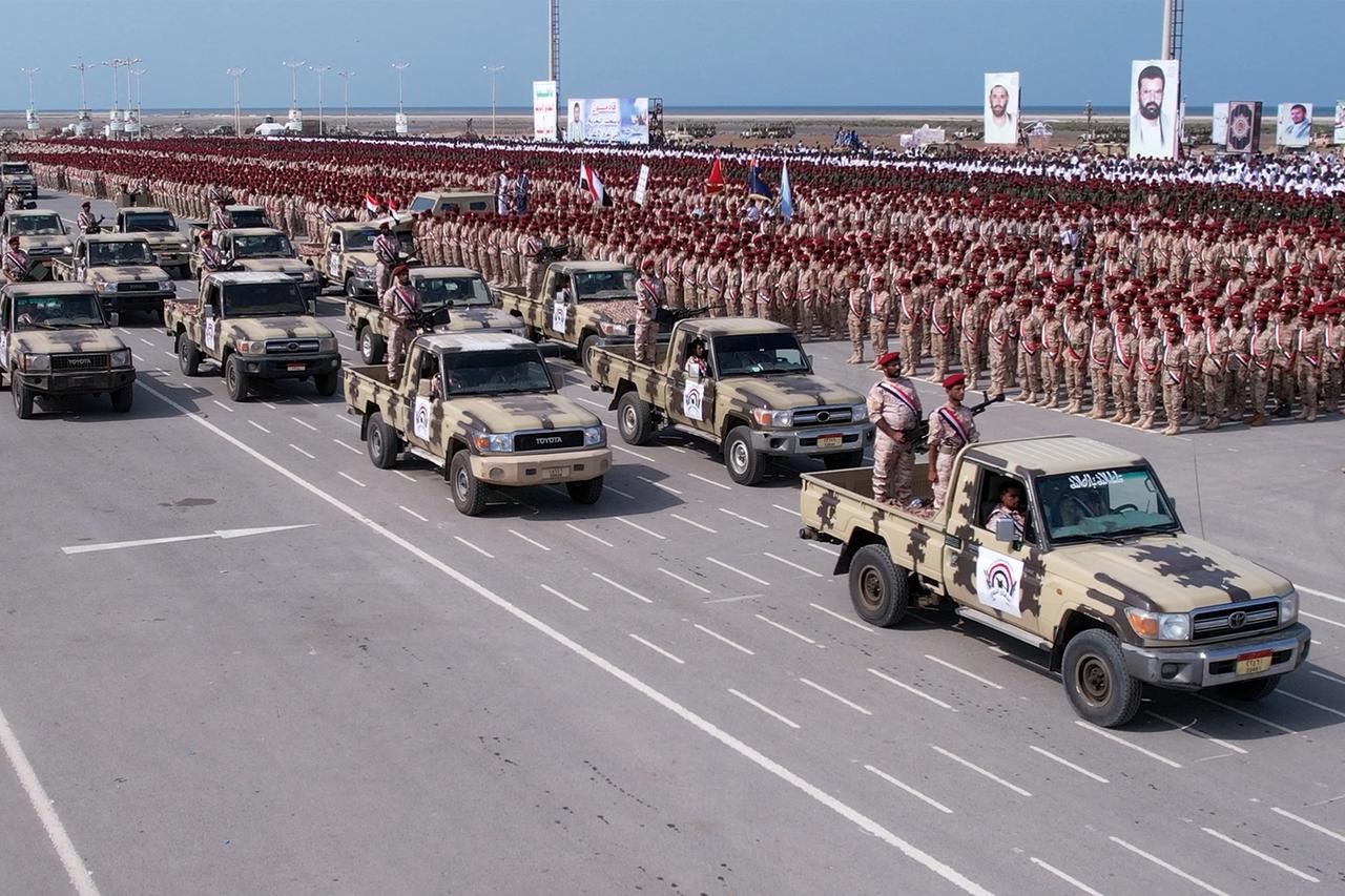 Members of Houthi military forces parade in the Red Sea port city of Hodeida