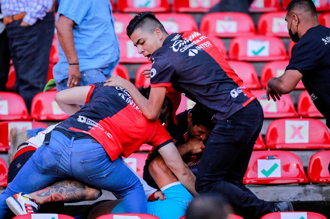 People are beaten at the Corregidora stadium in Queretaro