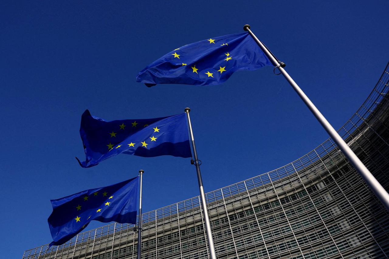 FILE PHOTO: European Union flags flutter outside the European Commission headquarters in Brussels