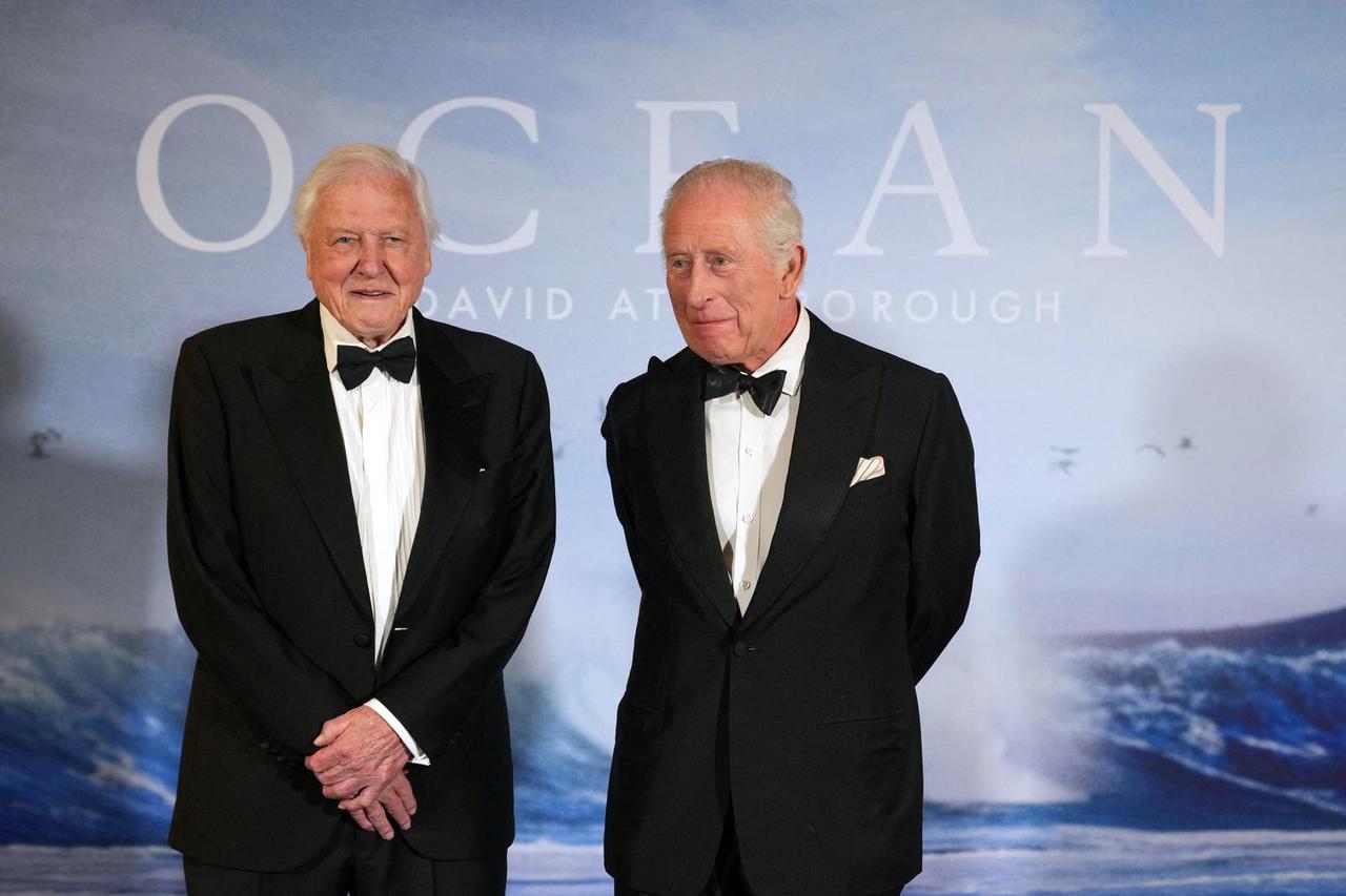 Britain's King Charles meets broadcaster and biologist David Attenborough as he attends the 'Ocean with David Attenborough' Film Premiere in London