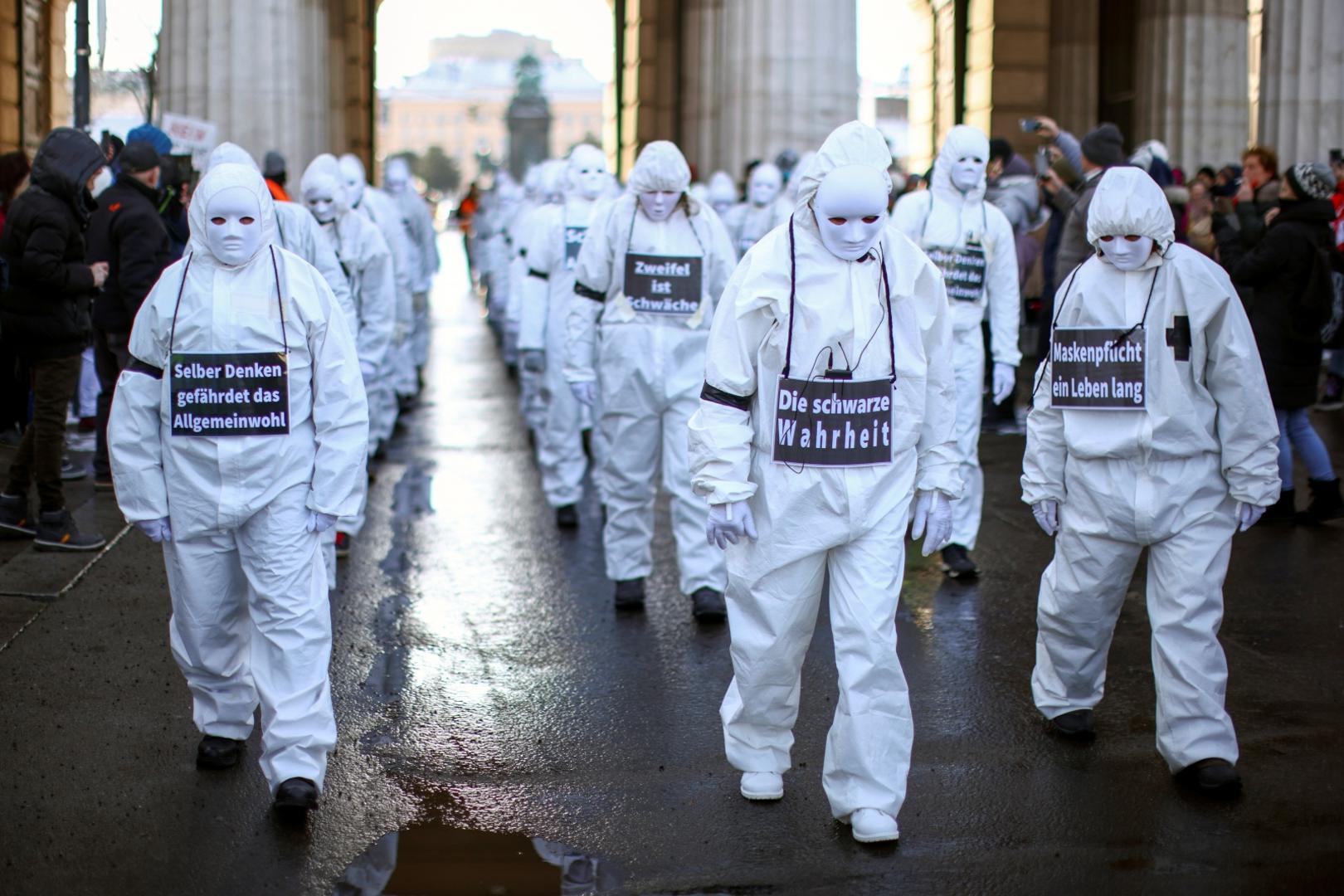 Demonstration against the COVID-19 measures and their economic consequences, in Vienna Protesters in white suits and wearing masks attend a demonstration against the coronavirus disease (COVID-19) measures and their economic consequences in Vienna, Austria, January 16, 2021. REUTERS/Lisi Niesner LISI NIESNER