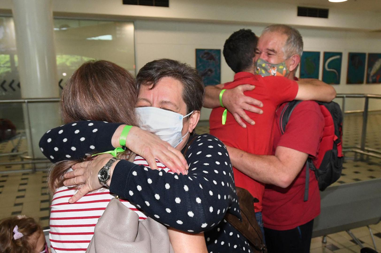 Julianna and Rudolf Nemeth from Hungary are reunited with their daughter and son-in-law Zsofi and David Kaityafter as they arrive on the first international flight to the Brisbane International Airport, after Australia reopened its international borders to travelers vaccinated against the coronavirus disease (COVID-19), in Brisbane, Australia Monday, February 21, 2022. AAP Image/Darren England via REUTERS ATTENTION EDITORS - THIS IMAGE WAS PROVIDED BY A THIRD PARTY. NO RESALES. NO ARCHIVE. AUSTRALIA OUT. NEW ZEALAND OUT. Photo: Stringer/REUTERS