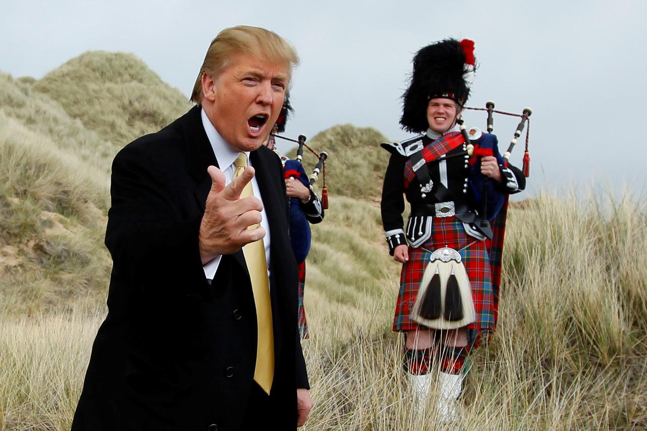 U.S. property mogul Donald Trump gestures during a media event on the sand dunes of the Menie estate, the site for Trump's proposed golf resort, near Aberdeen, Scotland, Britain May 27, 2010.  To match Special Report USA-ELECTION/TRUMP-GOLF     REUTERS/Da