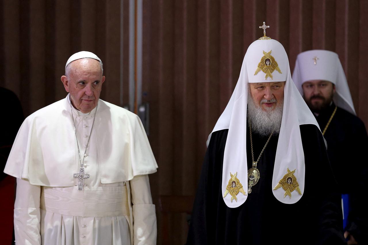 FILE PHOTO: Pope Francis and Russian Orthodox Patriarch Kirill stand together after a 2016 meeting in Havana