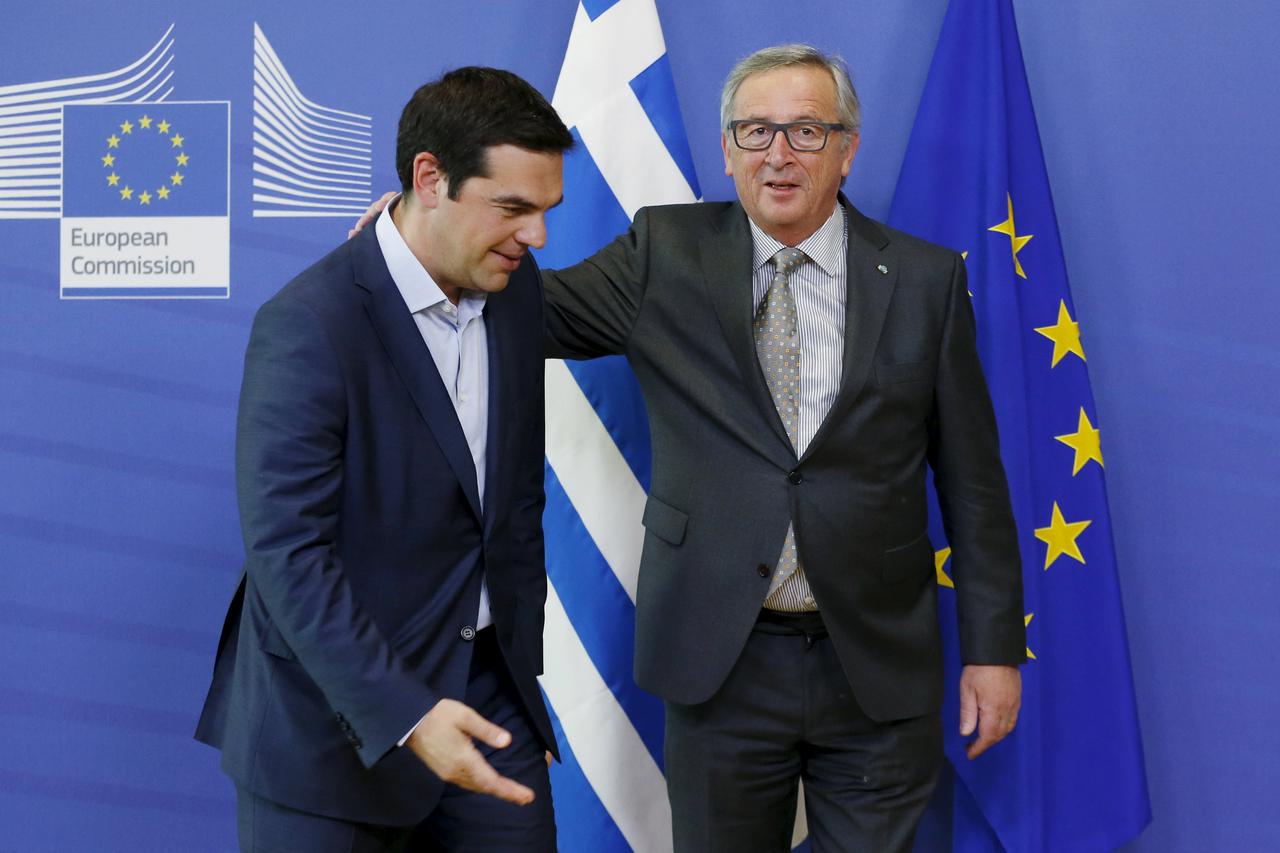 Greek Prime Minister Alexis Tsipras (L) poses with European Commission President Jean-Claude Juncker ahead of a meeting at the EU Commission headquarters in Brussels, Belgium, June 3, 2015. Greece's international creditors signalled on Wednesday they were