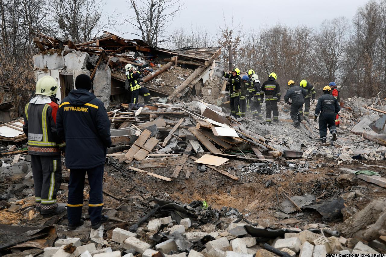 Rescuers work at a site damaged during a Russian missile strike, in Kyiv