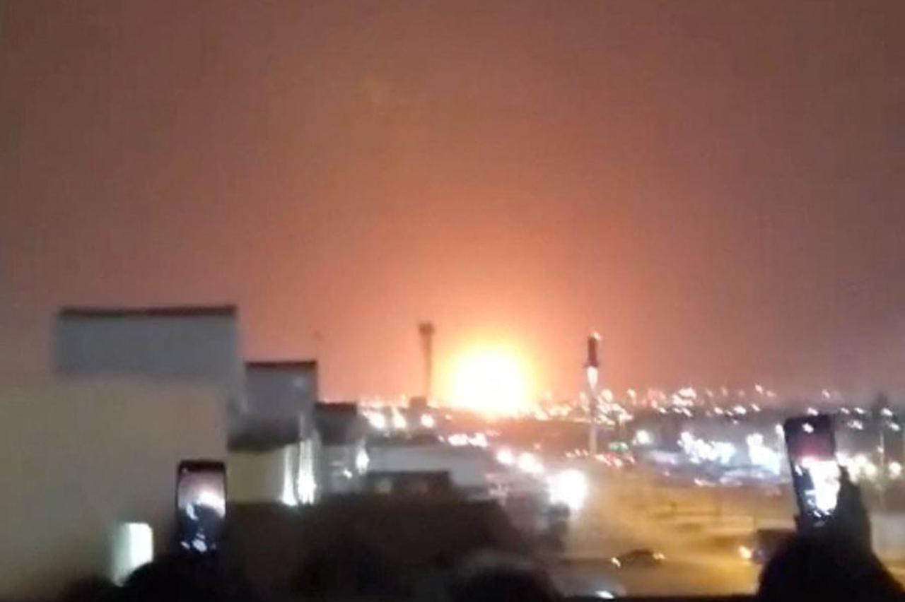 Fire rises from an explosion following a strike near oil company Aramco, in Riyadh