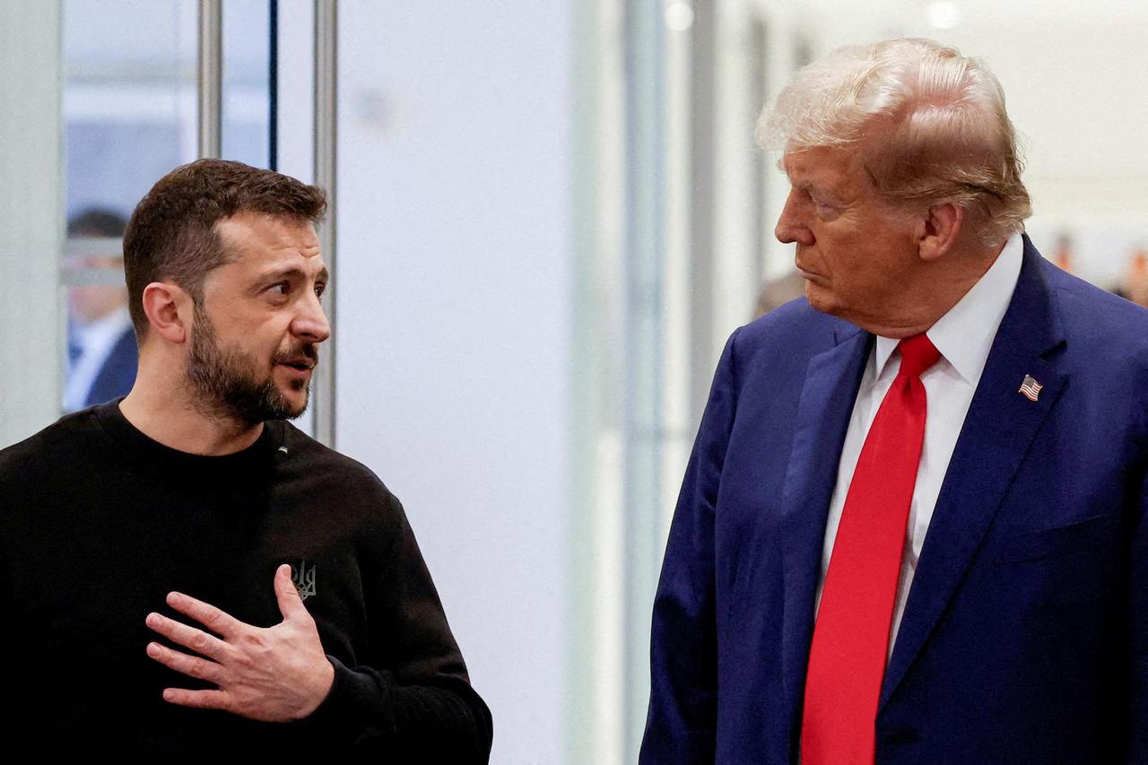 FILE PHOTO: Republican presidential nominee and former U.S. President Donald Trump and Ukraine's President Volodymyr Zelenskiy meet in New York