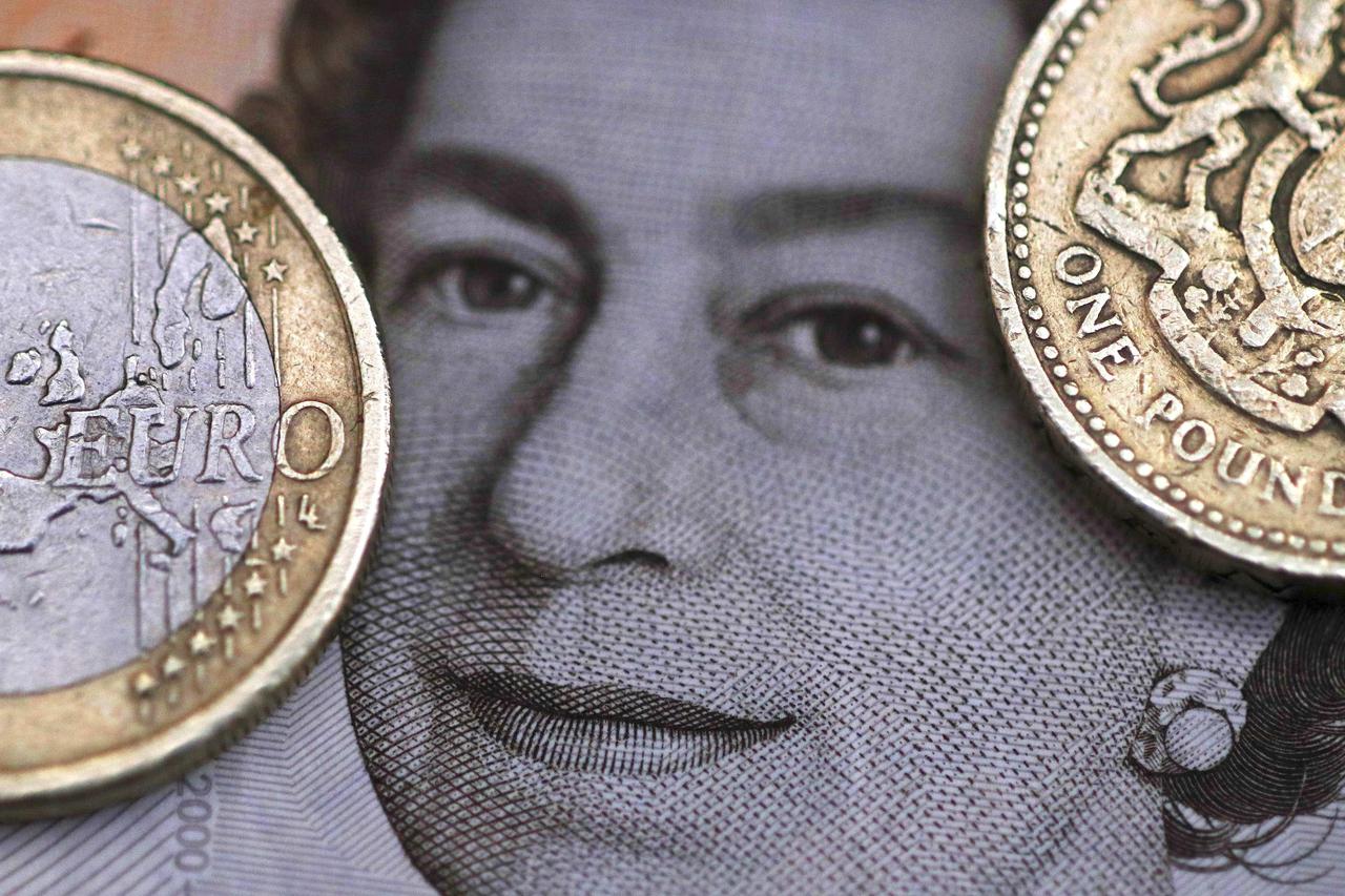 File photo illustration of a two Euro coin pictured next to a one Pound coin on top of a portrait of Britain's Queen ElizabethA two Euro coin is pictured next to a one Pound coin on top of a portrait of Britain's Queen Elizabeth in this file photo illustr