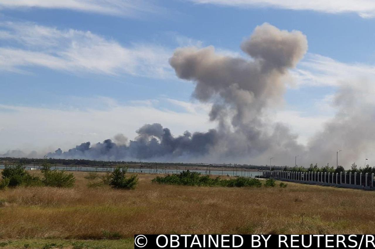 Smoke rises after explosions were heard near Novofedorivka