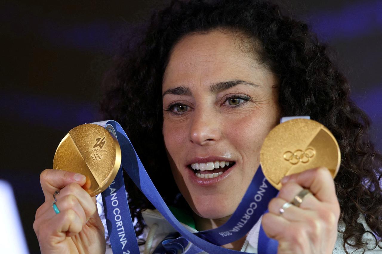 FILE PHOTO: Italy's alpine skier Federica Brignone shows her two gold medals after a press conference in Cortina d'Ampezzo