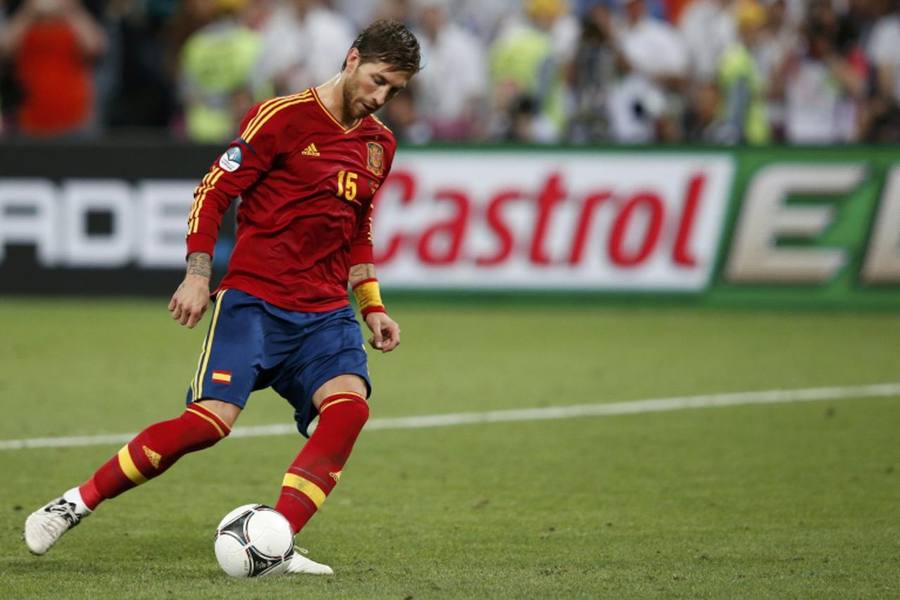 'Spain\'s Sergio Ramos kicks to score a penalty goal against Portugal during the penalty shoot-out in their Euro 2012 semi-final soccer match at the Donbass Arena in Donetsk, June 27, 2012.           