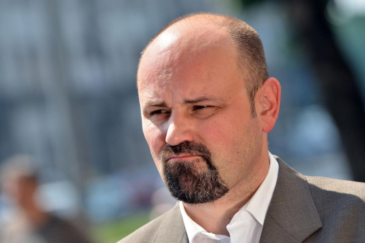 'Serbia\'s deputy war crimes prosecutor Bruno Vekaric gives an interview in front of the Special court for war crimes in Belgrade on May 26, 2011. Serbia on Thursday announced the arrest of former Bos