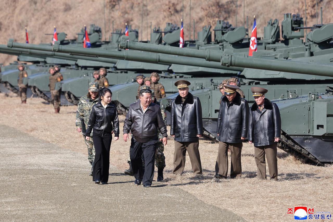 North Korean leader Kim Jong Un supervises what North Korean state news agency KCNA reports is an offensive tactical drill involving a new type of tank, at a training base in Pyongyang