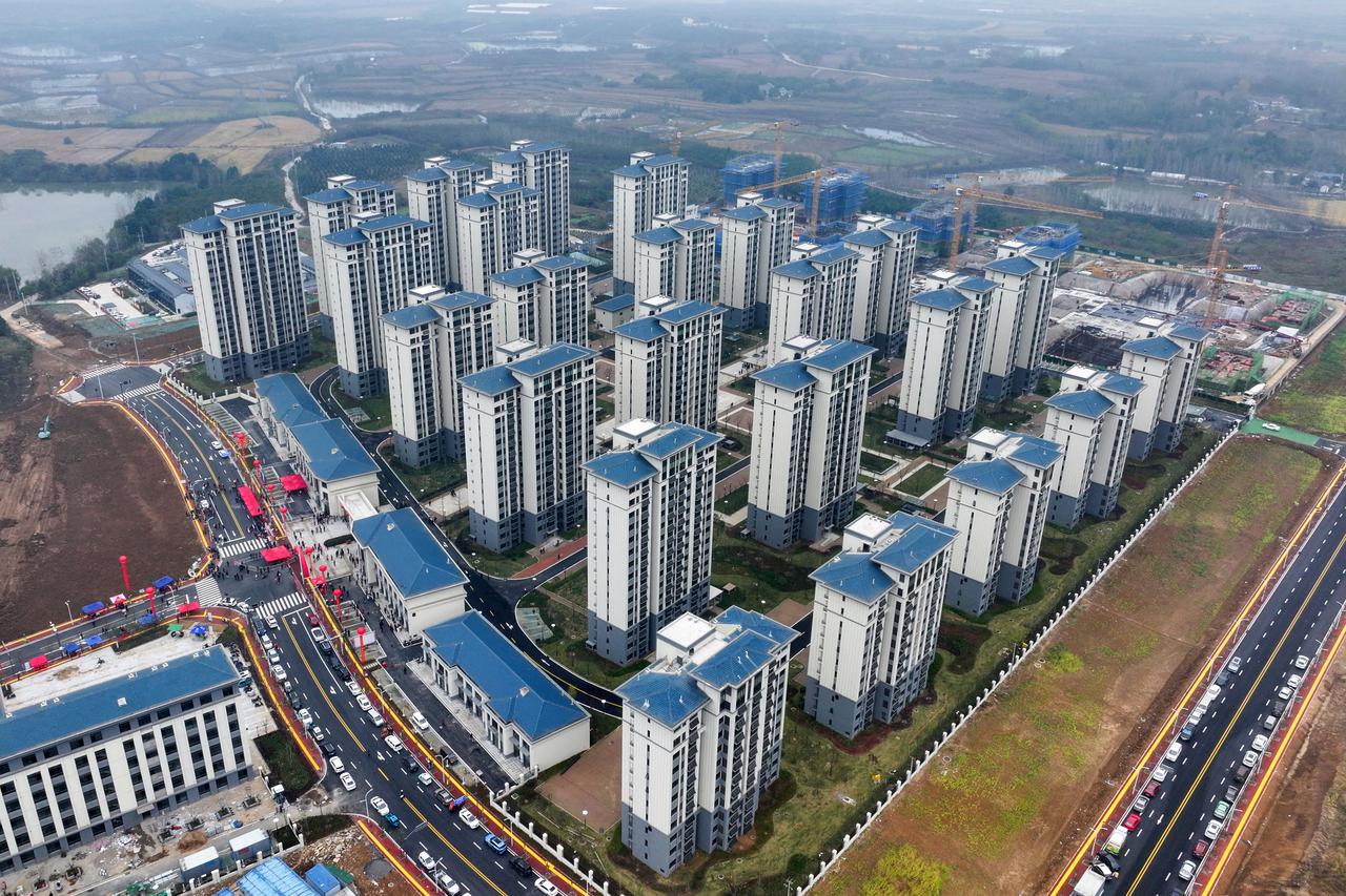Xinhua Headlines: China abolishes mortgage floor rates, cuts minimum down payment ratios to boost property market