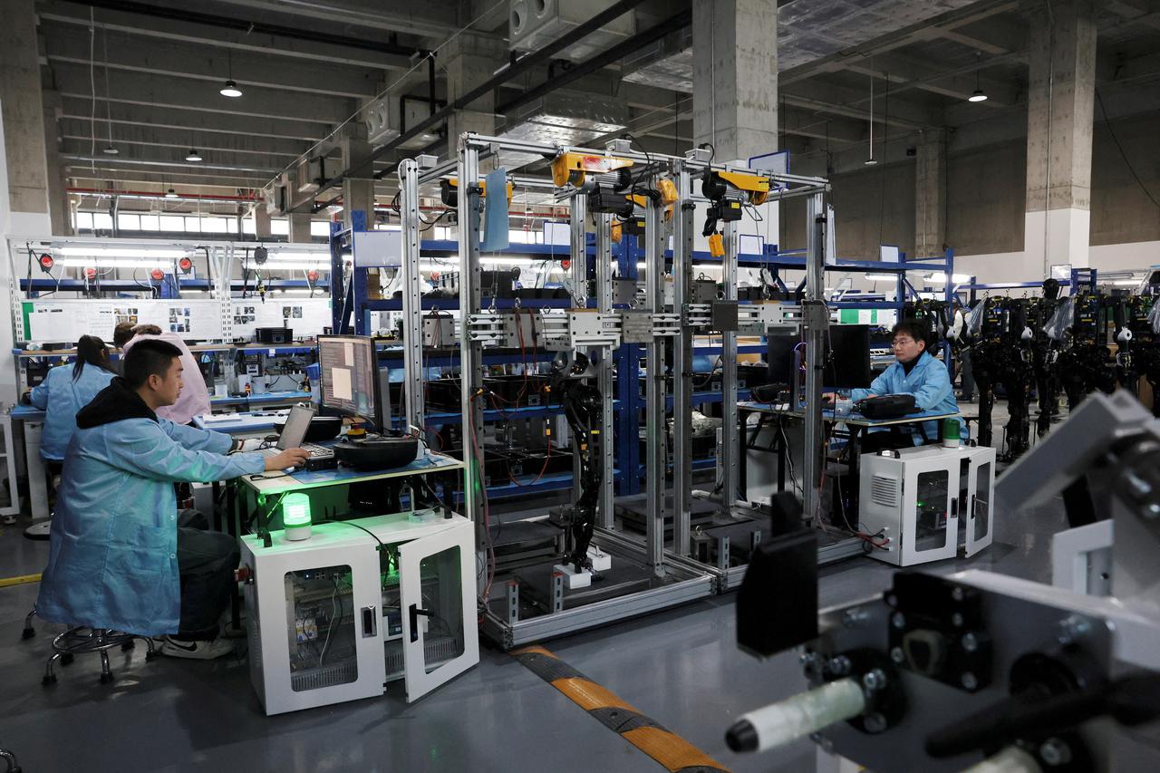 FILE PHOTO: Humanoid robots production at AgiBot factory in Shanghai