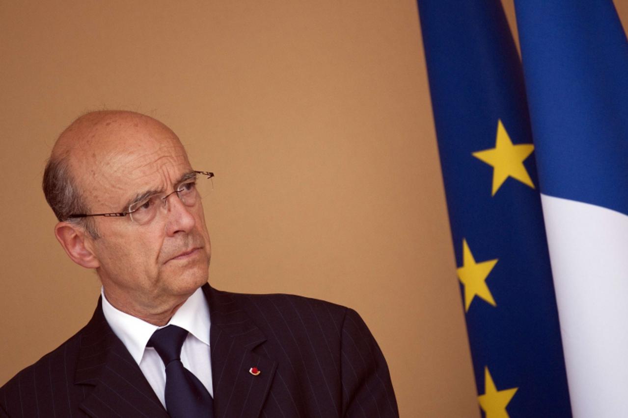 'French Foreign Minister Alain Juppe is seen on May 21, 2011 in Abidjan as French president Nicolas Sarkozy addresses a speech to the French community a few hours after Alassane Ouattara\'s investitur
