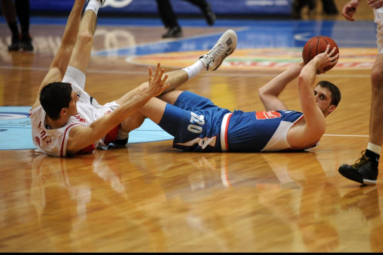 '30.04.2011.,dvorana Sutinsta vrela,  Zagreb -Doigravanje prvenstva Hrvatske u kosarci izmedju domacina Cedevite i gostiju Cibone  .Damjan Rudez,Marin Rozic Photo: Daniel Kasap/PIXSELL'