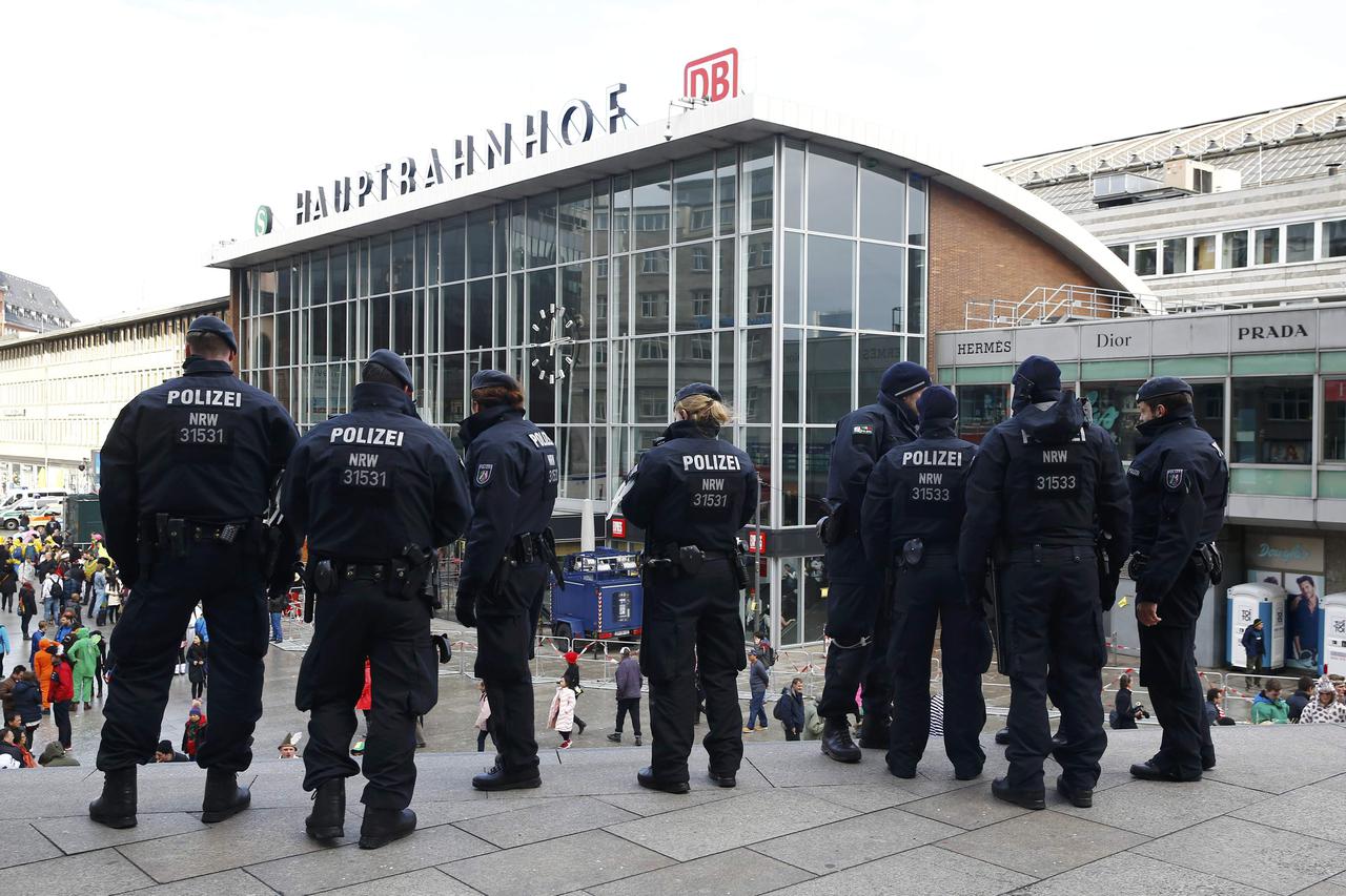 German police officers stand outside the railway station during the 