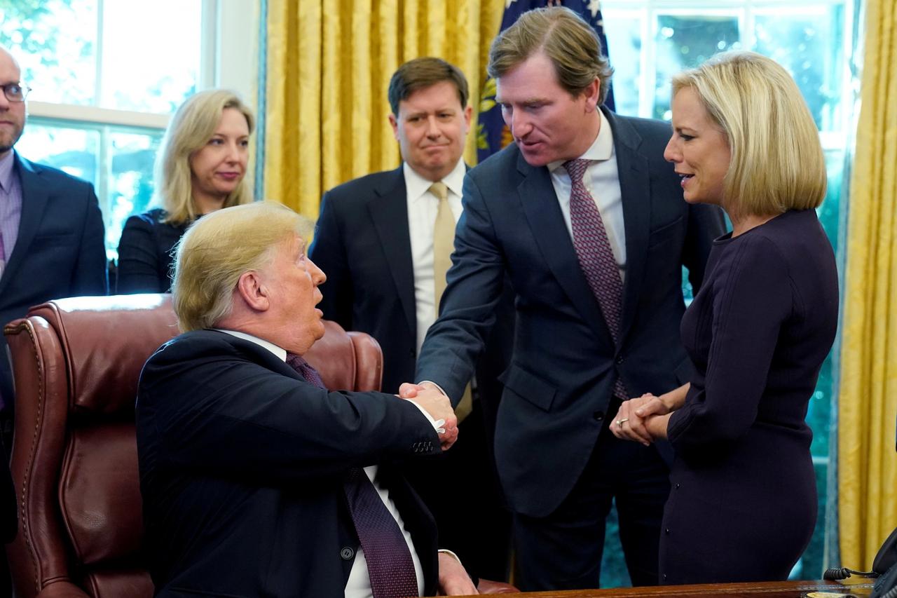 FILE PHOTO: U.S. President Trump shakes hands with Krebs at Cybersecurity and Infrastructure signing ceremony in Oval Office of White House in Washington