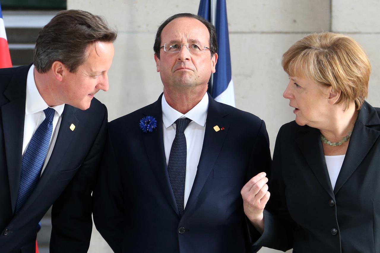 (L-R) Britain's Prime Minister David Cameron, France's President Francois Hollande and Germany's Chancellor Angela Merkel attend a 
