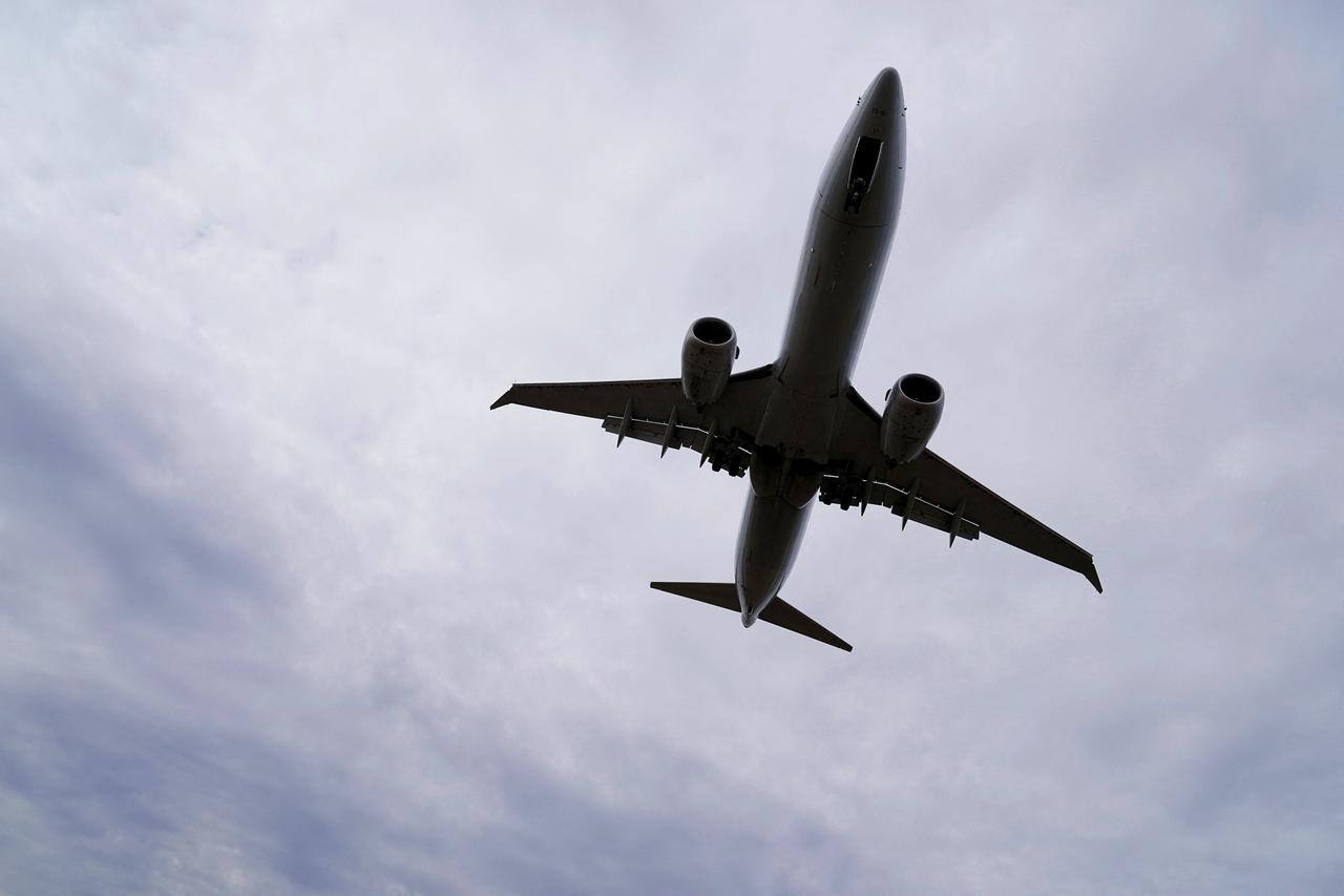 FILE PHOTO: An American Airlines Boeing 737 MAX 8 flight approaches for landing at Reagan National Airport in Washington