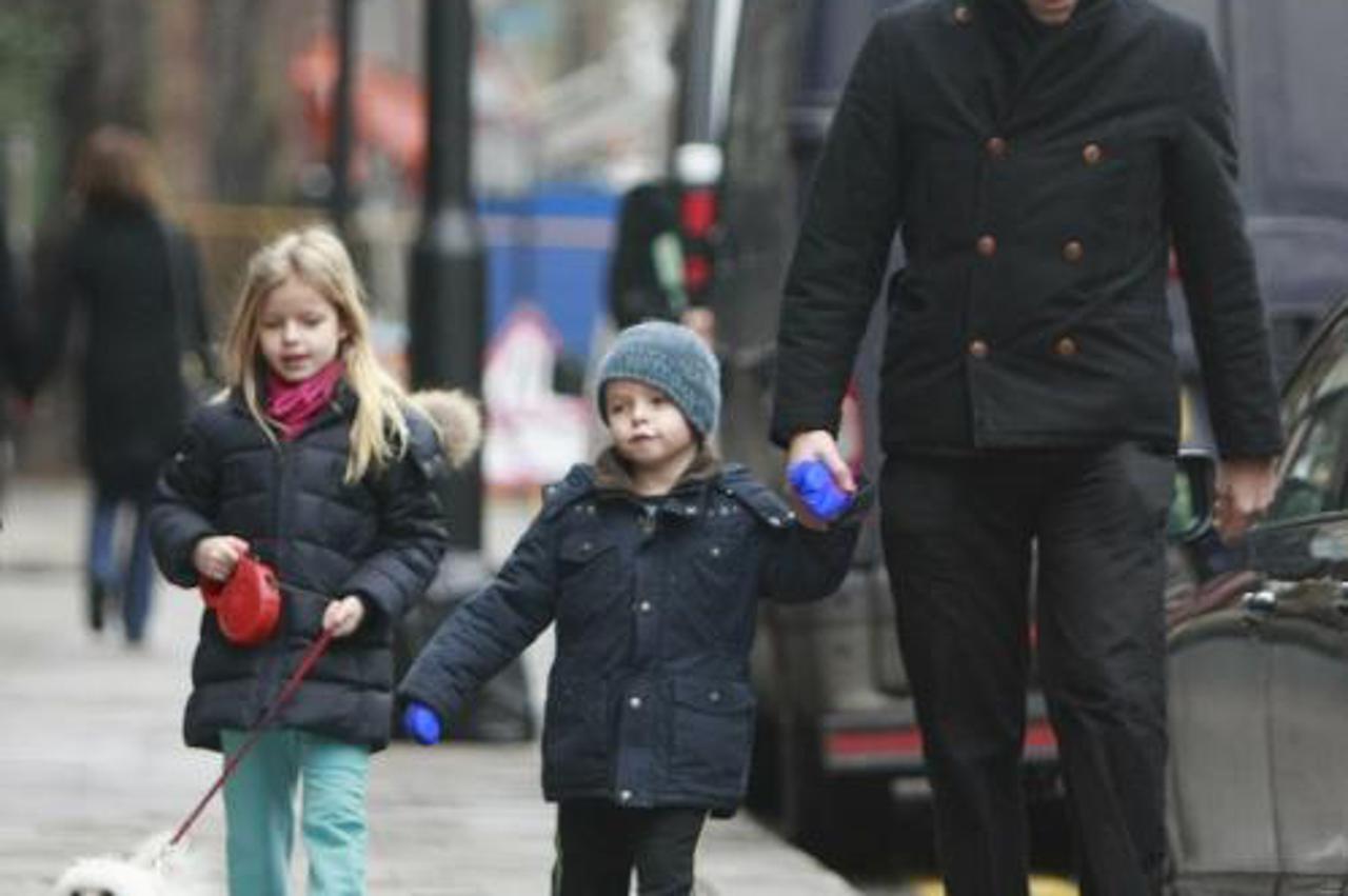 'EXCLUSIVE ALL-ROUND PICTURES  WORLD RIGHTS  Chris Martin and his kids Moses and Apple take the dog for a walk, London, UK. 23/01/2011  BYLINE DAN BOZINOVSKI/BIGPICTURESPHOTO.COM:   REF:001/ZB  USAGE 