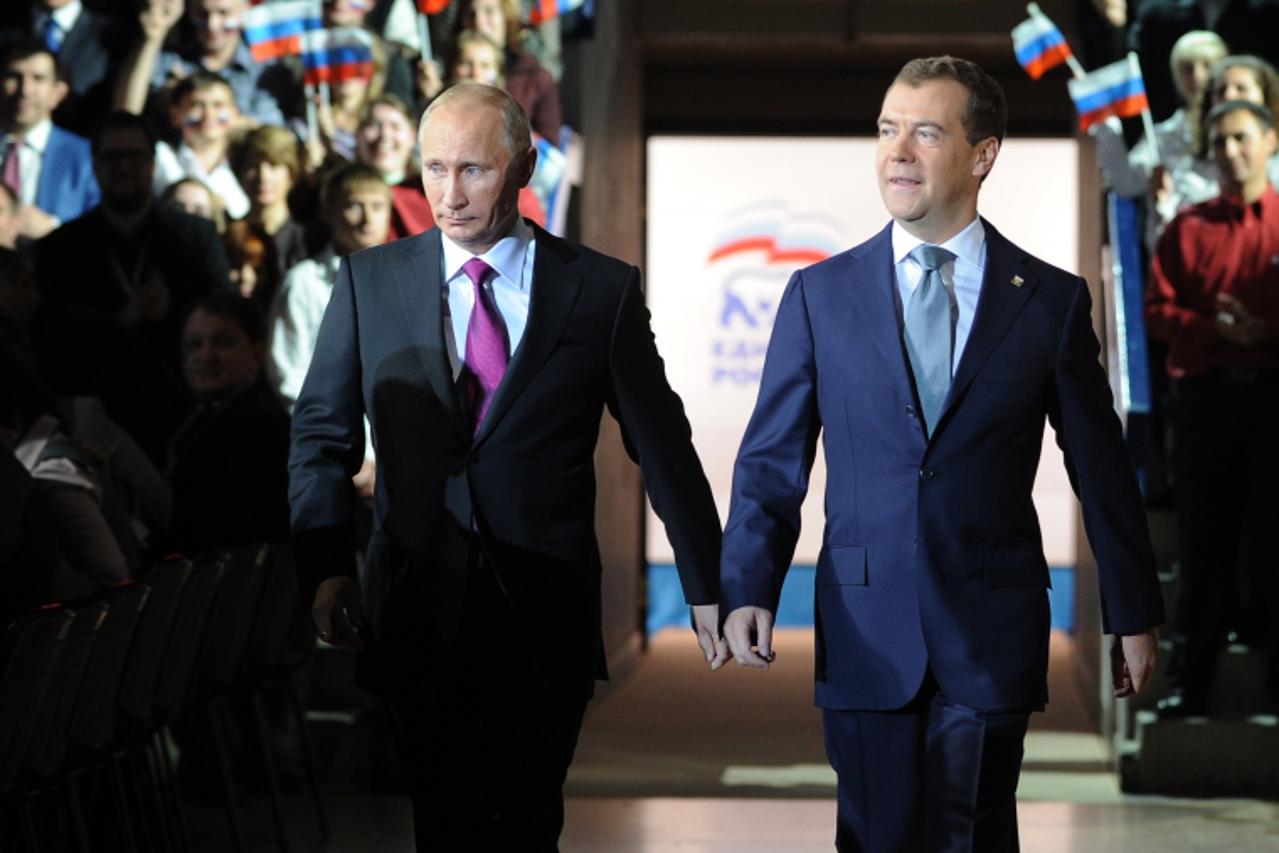 'Russia\'s President Dmitry Medvedev and Prime Minister Vladimir Putin make a joint appearance at the congress of Russia\'s ruling party in Moscow, on September 24, 2011.Russian President Dmitry Medve
