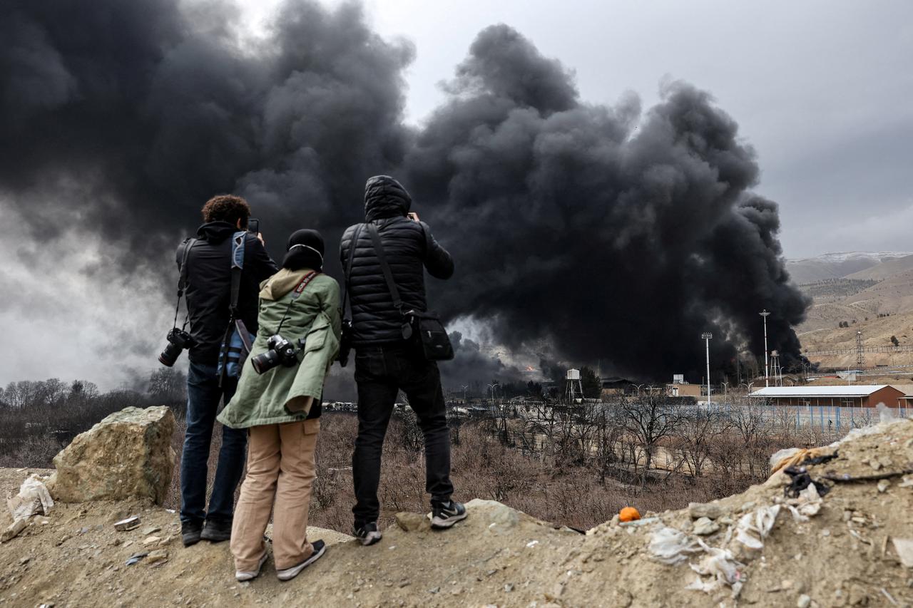 Smoke rises after a reported strike on Shahran fuel tanks, amid the U.S.-Israeli conflict with Iran, in Tehran