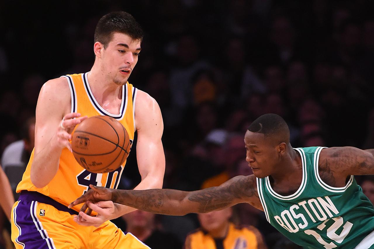 NBA: Boston Celtics at Los Angeles Lakers Mar 3, 2017; Los Angeles, CA, USA; Boston Celtics guard Terry Rozier (12) knocks the ball from the hands of Los Angeles Lakers center Ivica Zubac (40) in the second half of the game at Staples Center. The Celtics 