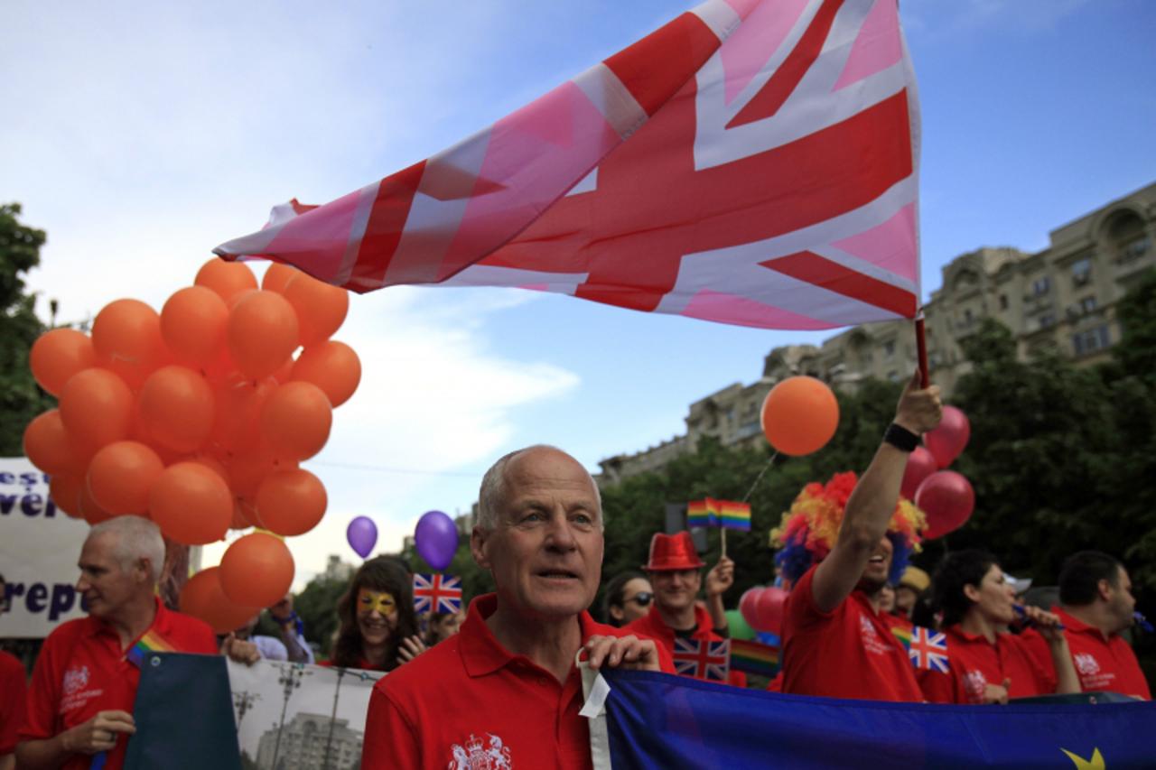 'Michael Cashman, the British Labour Member of European Parliament (MEP) for the West Midlands, participates in the GayFest 2010 parade in Bucharest, May 22, 2010.    REUTERS/Radu Sigheti  (ROMANIA - 