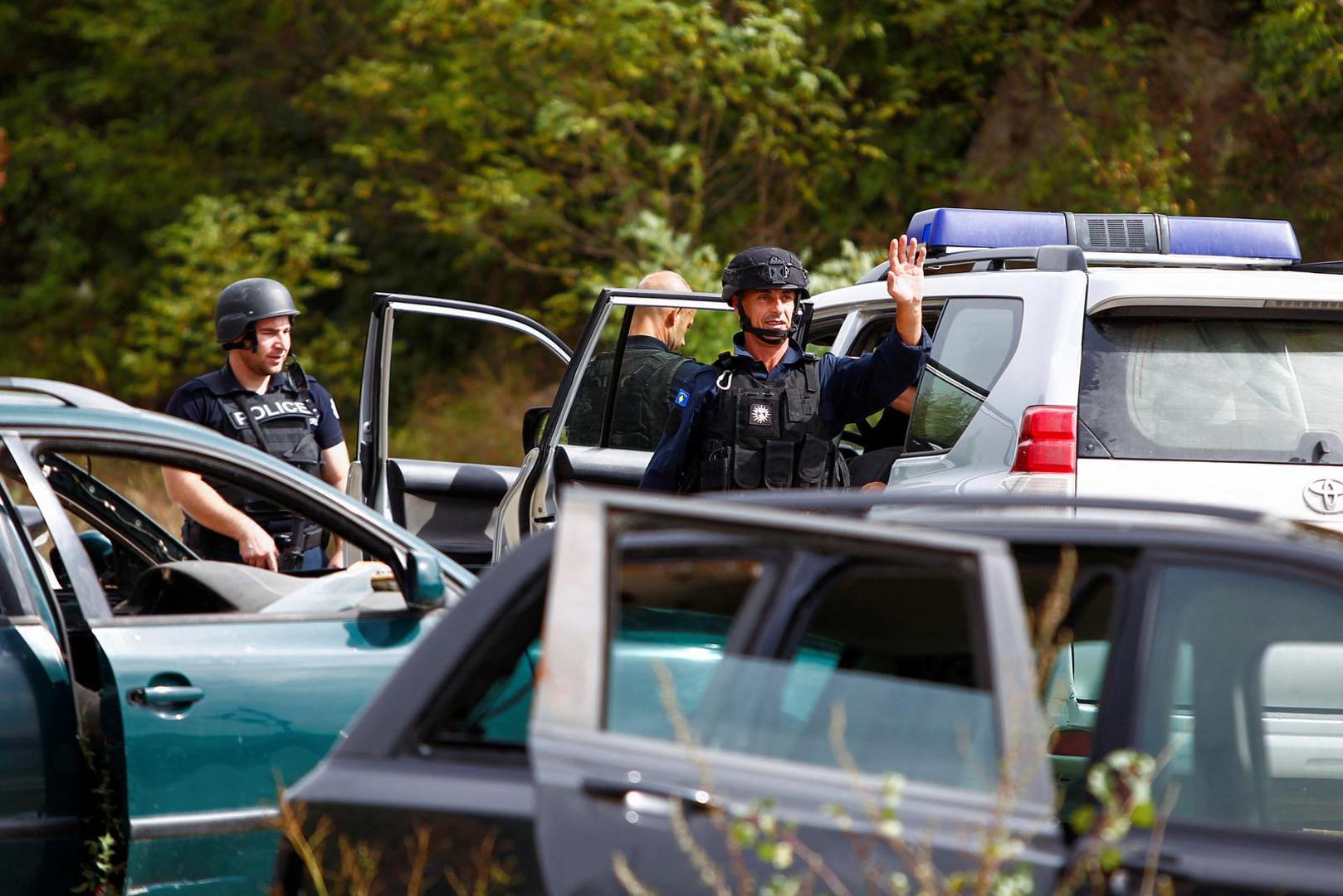 Police officers keep guard in the aftermath of a shooting, near the village of Zvecane, Kosovo September 24, 2023. REUTERS/Ognen Teofilovski Photo: OGNEN TEOFILOVSKI/REUTERS