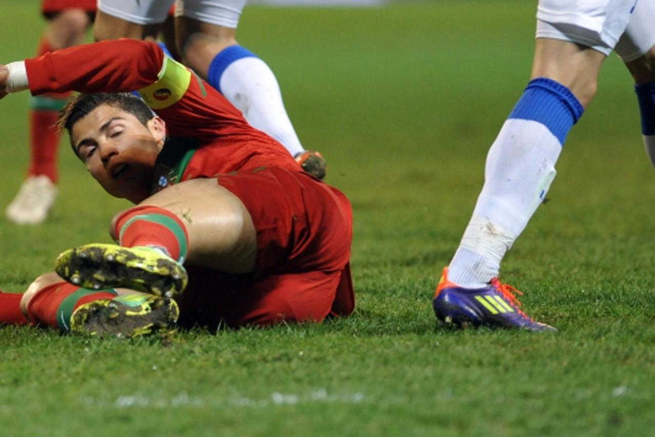 \'Cristiano Ronaldo of Portugal reacts after a foul during the Euro 2012 Qualifier Play Off First Leg football match between Bosnia and Herzegovina and Portugal in Zenica, north of the capital Sarajev