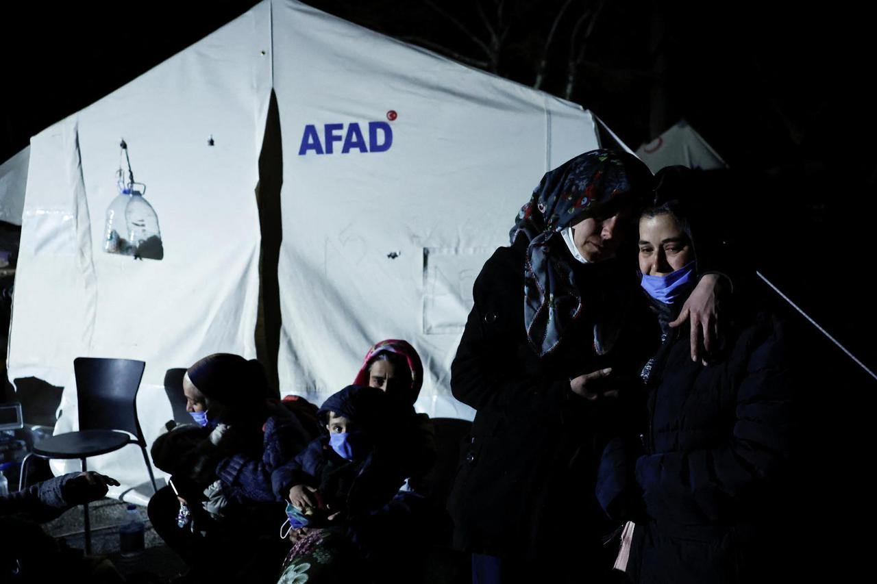 People react after a quake in Antakya in Hatay province, Turkey