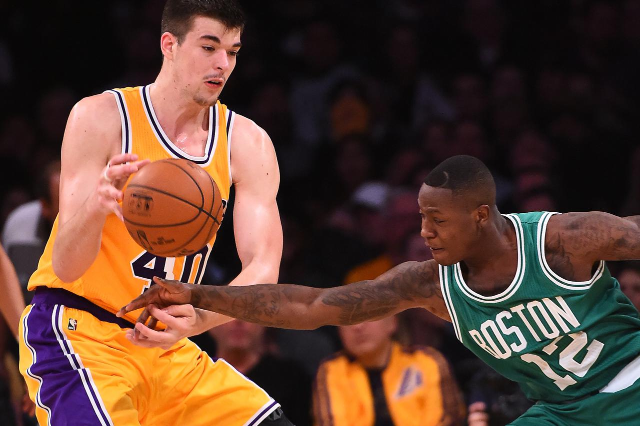 NBA: Boston Celtics at Los Angeles Lakers Mar 3, 2017; Los Angeles, CA, USA; Boston Celtics guard Terry Rozier (12) knocks the ball from the hands of Los Angeles Lakers center Ivica Zubac (40) in the second half of the game at Staples Center. The Celtics 
