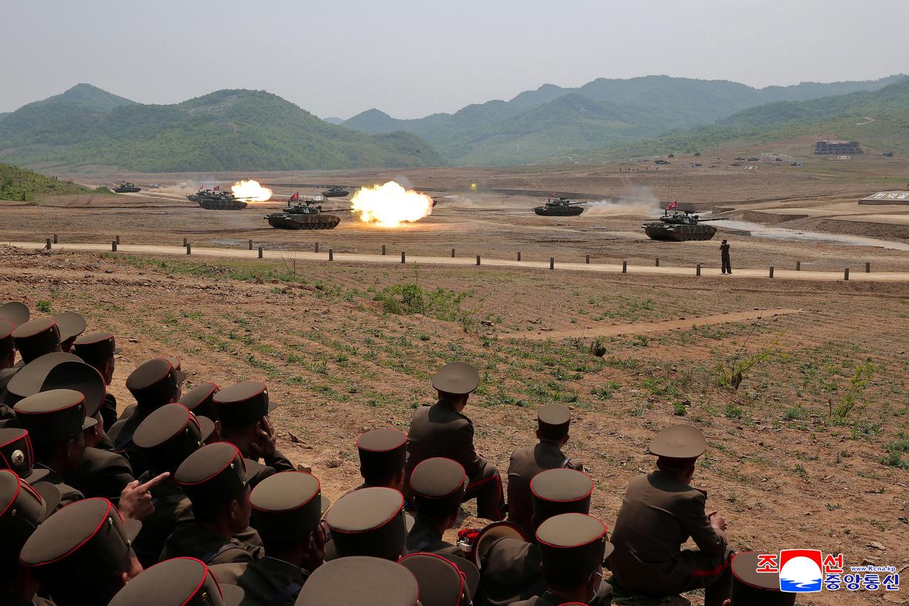 North Korean Leader Kim Jong Un attends what KCNA reported was tactical training by military special forces and a firing drill by tank units, at an unknown location