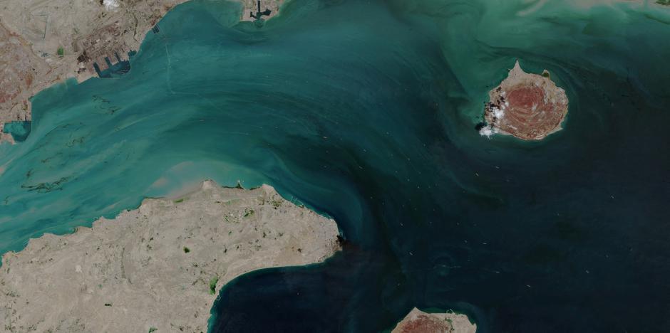 A satellite image shows the ship movement at the Strait of Hormuz
