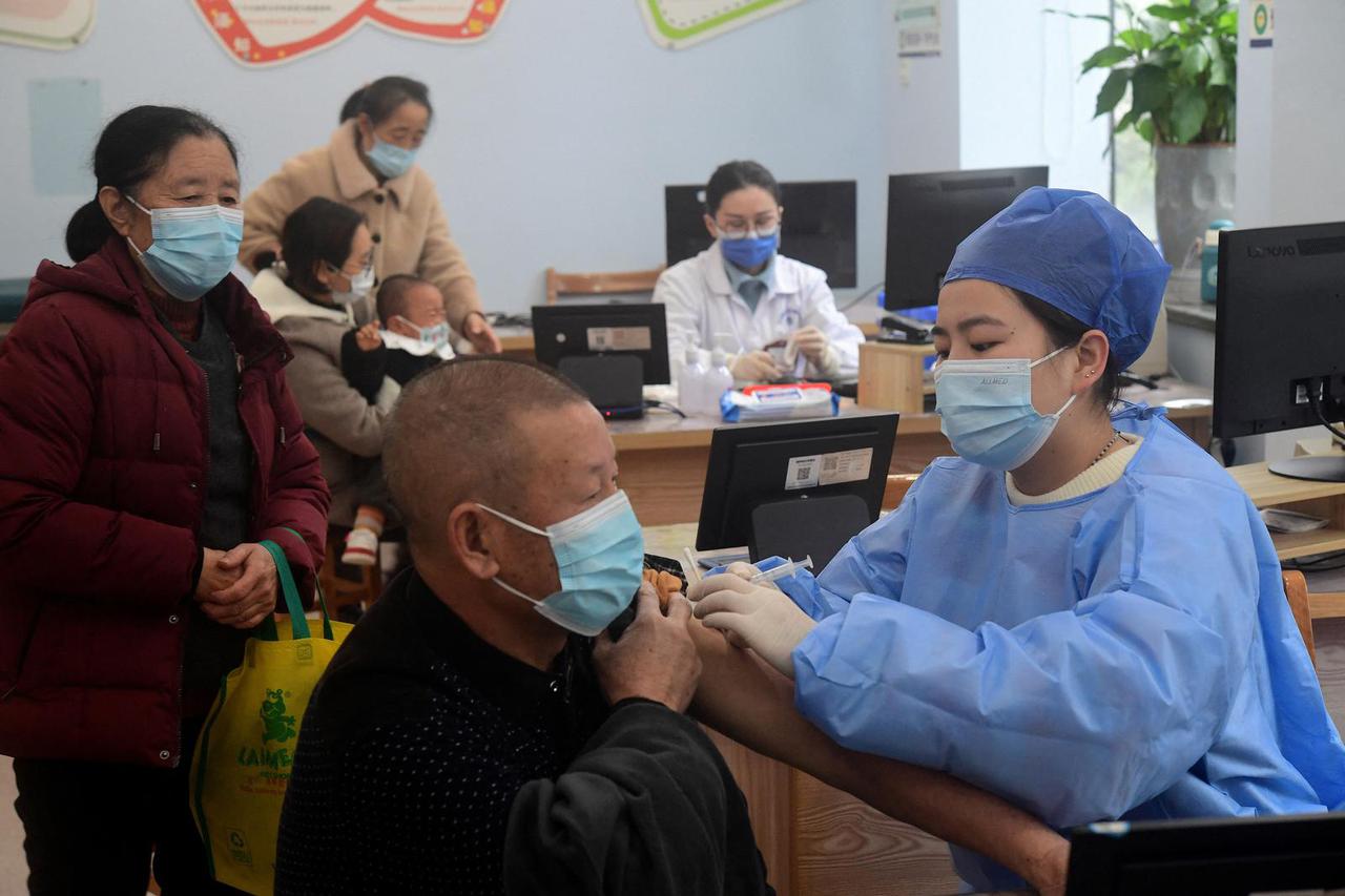 Medical worker administers a dose of COVID-19 vaccine to a resident in Jinhua