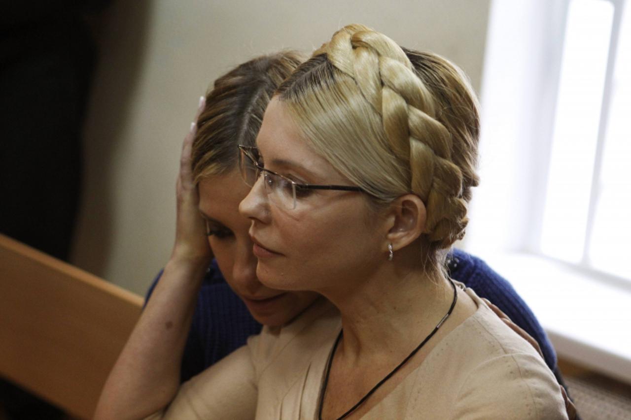 'File picture shows Ukrainian former prime minister Yulia Tymoshenko (R) and her daughter Yevhenia at a session in the Pecherskiy district court in Kiev October 11, 2011. Despite winning rare praise f