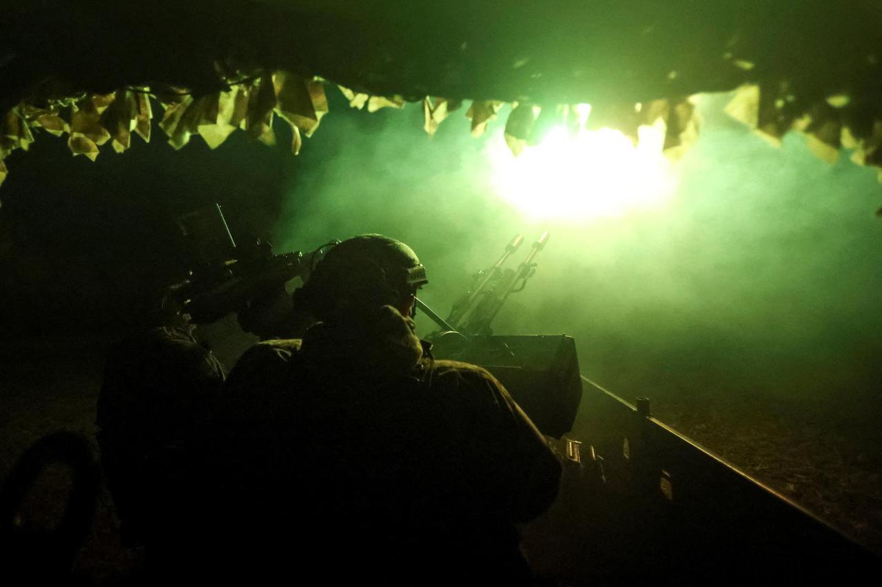 Ukrainian servicemen from an anti-drone mobile air defence unit fire a ZU-2 anti-aircraft cannon during combat shift on the front line in the Donetsk region