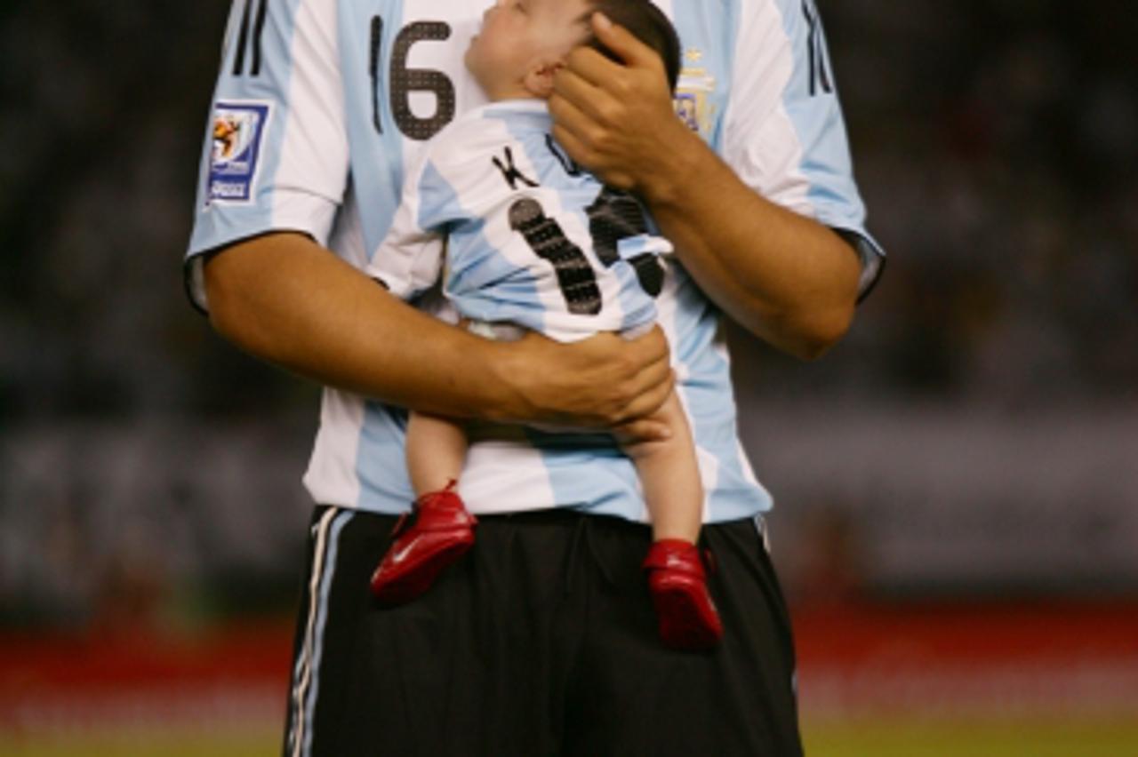 'Soccer - 2010 World Cup Qualifier - South American Group - Argentina v Venezuela Sergio Aguero and his son before the game'
