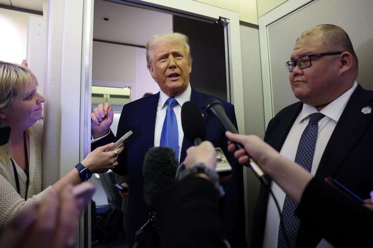 Trump speaks to reporters aboard Air Froce One