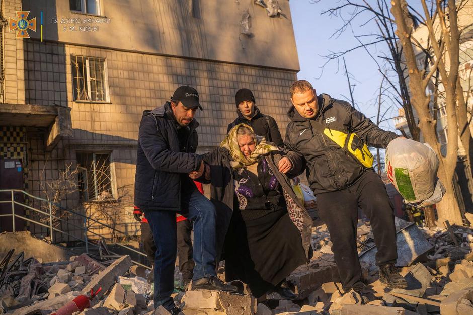 Evacuation from a residential building damaged by shelling in Kyiv