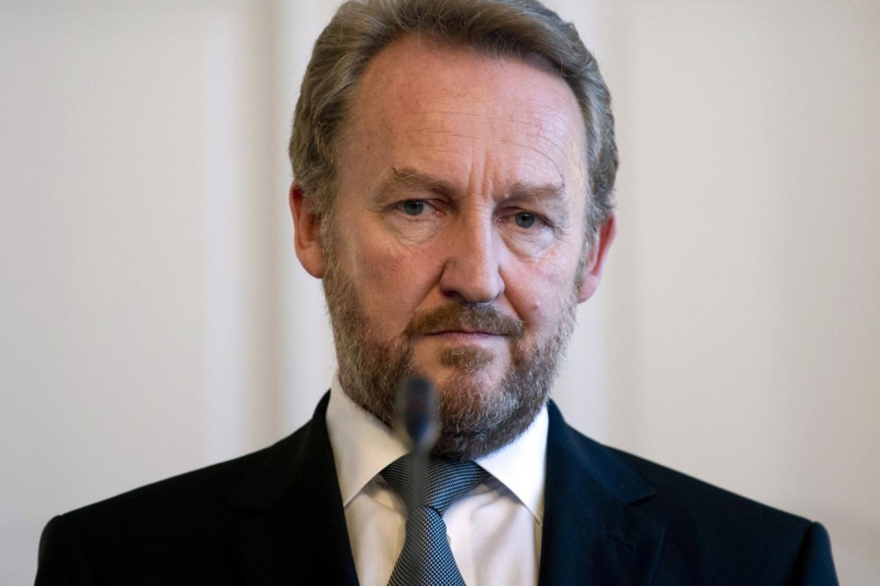 'Chairman of the Bosnia and Herzegovina Tri-Presidency Bakir Izetbegovic listens as U.S. Secretary of State Hillary Clinton (not pictured) speaks during a news conference in Sarajevo October 30, 2012.