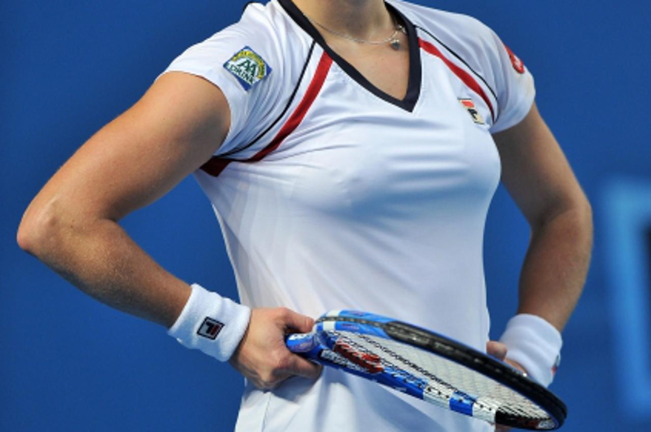 'Belgian tennis player Kim Clijsters gestures during her women\'s singles match against Russian opponent Nadia Petrova on the fifth day of play at the Australian Open tennis tournament in Melbourne on